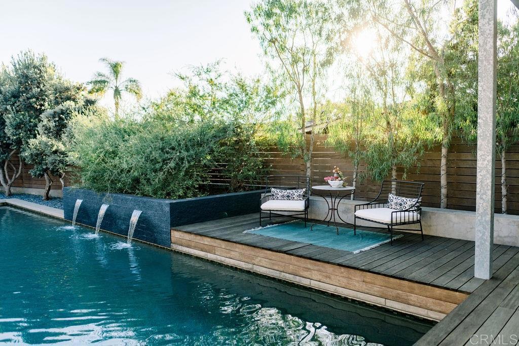 1866 Sheridan Road Encinitas, CA 92024 - Photo 21 of 25 a view of a backyard with lawn chairs wooden floor and fence