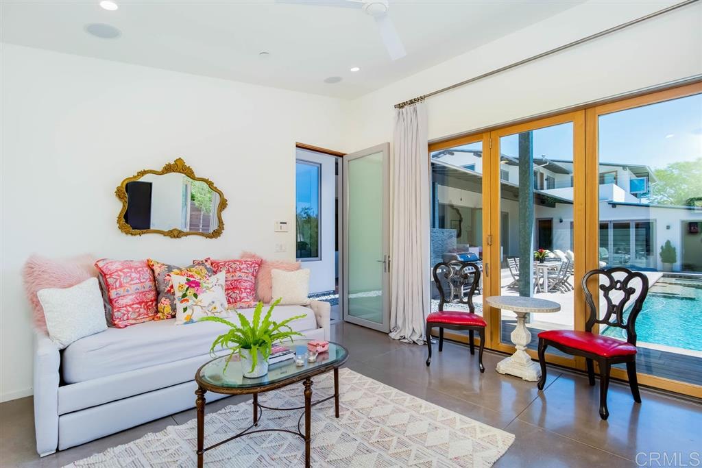 1866 Sheridan Road Encinitas, CA 92024 - Photo 24 of 25 a living room with furniture and floor to ceiling windows