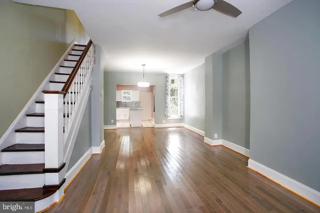a view of an entryway with wooden floor