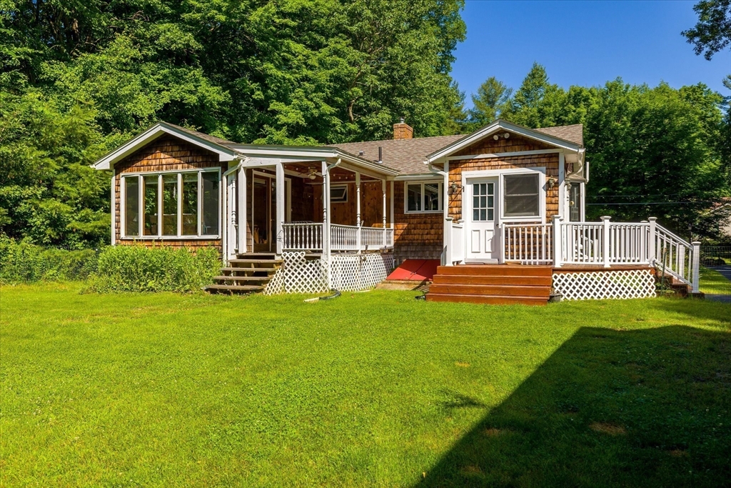 26 Bay Path Road Charlton, MA 01507 - Photo 20 of 38 a front view of a house with a yard