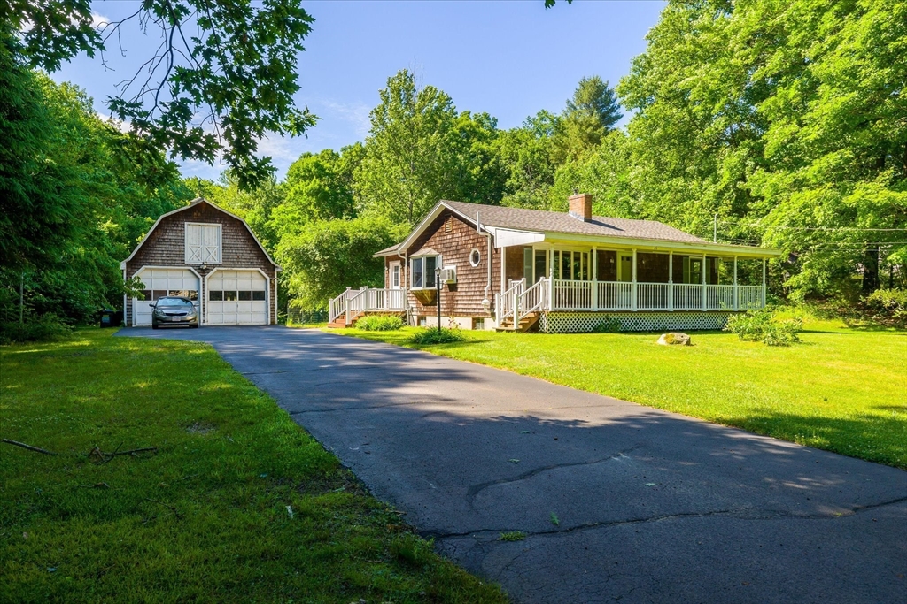 26 Bay Path Road Charlton, MA 01507 - Photo 24 of 38 a view of house with garden and tall trees