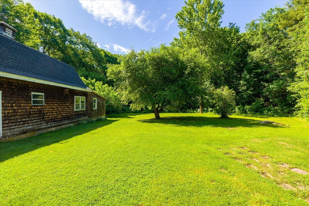 26 Bay Path Road Charlton, MA 01507 - Photo 25 of 38 a view of a swimming pool with an outdoor space and seating area