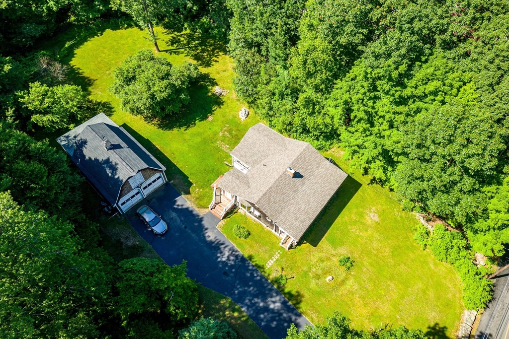 26 Bay Path Road Charlton, MA 01507 - Photo 30 of 38 an aerial view of a house with a yard and trees all around