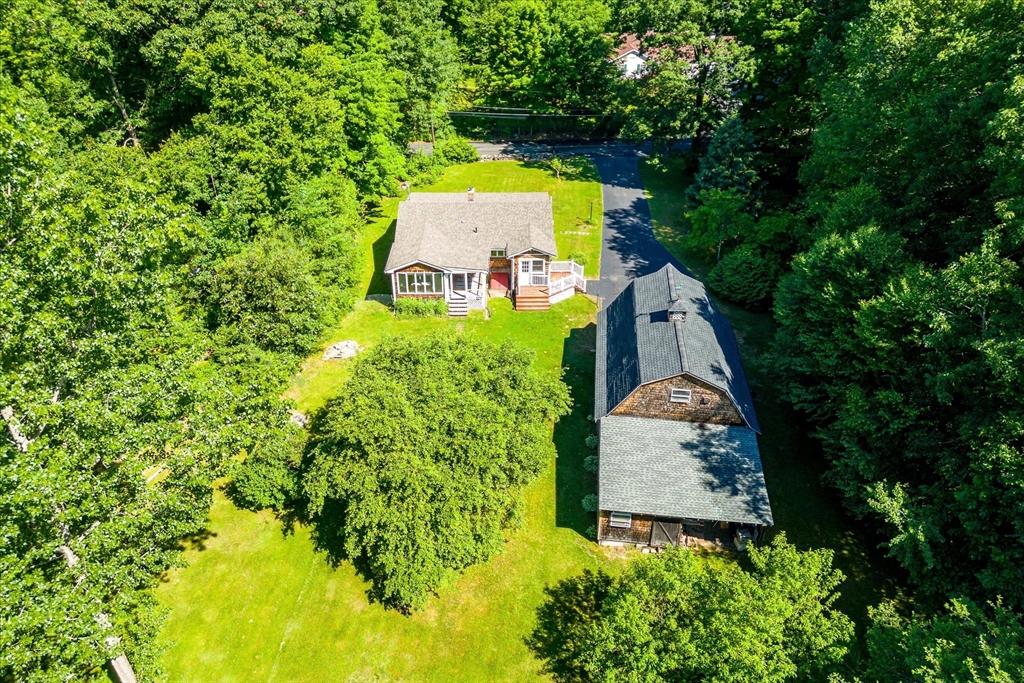 26 Bay Path Road Charlton, MA 01507 - Photo 34 of 38 an aerial view of a house with a yard and trees all around
