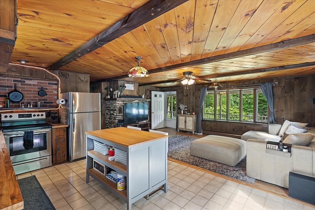26 Bay Path Road Charlton, MA 01507 - Photo 4 of 38 a outdoor space with patio lots of furniture and tub