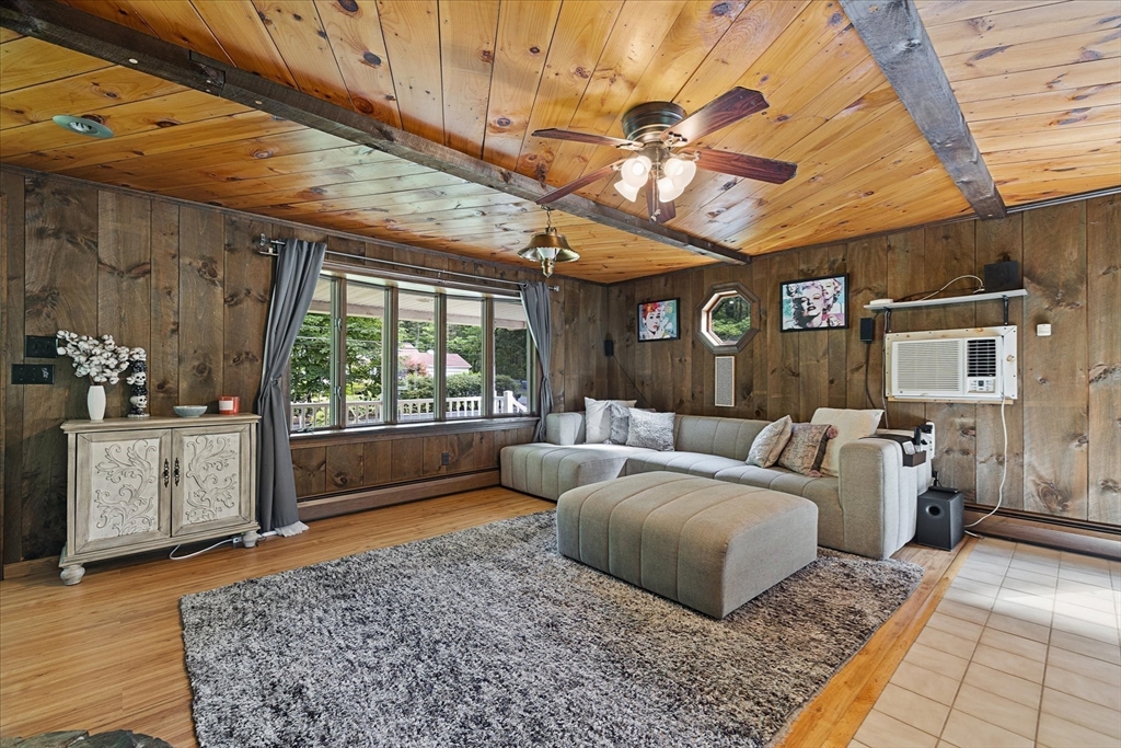 26 Bay Path Road Charlton, MA 01507 - Photo 6 of 38 a living room with furniture and a chandelier