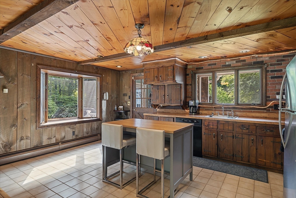 26 Bay Path Road Charlton, MA 01507 - Photo 9 of 38 a kitchen with a counter space a sink appliances and cabinets