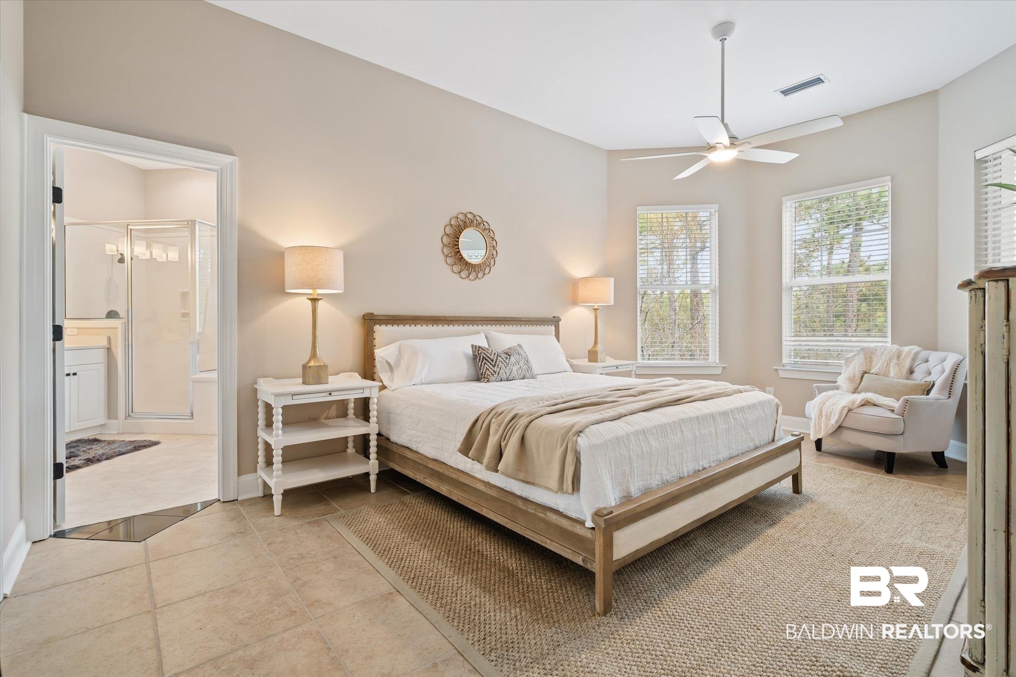 9259 Genipa Way Gulf Shores, AL 36542 - Photo 26 of 72 Tiled bedroom featuring connected bathroom and ceiling fan