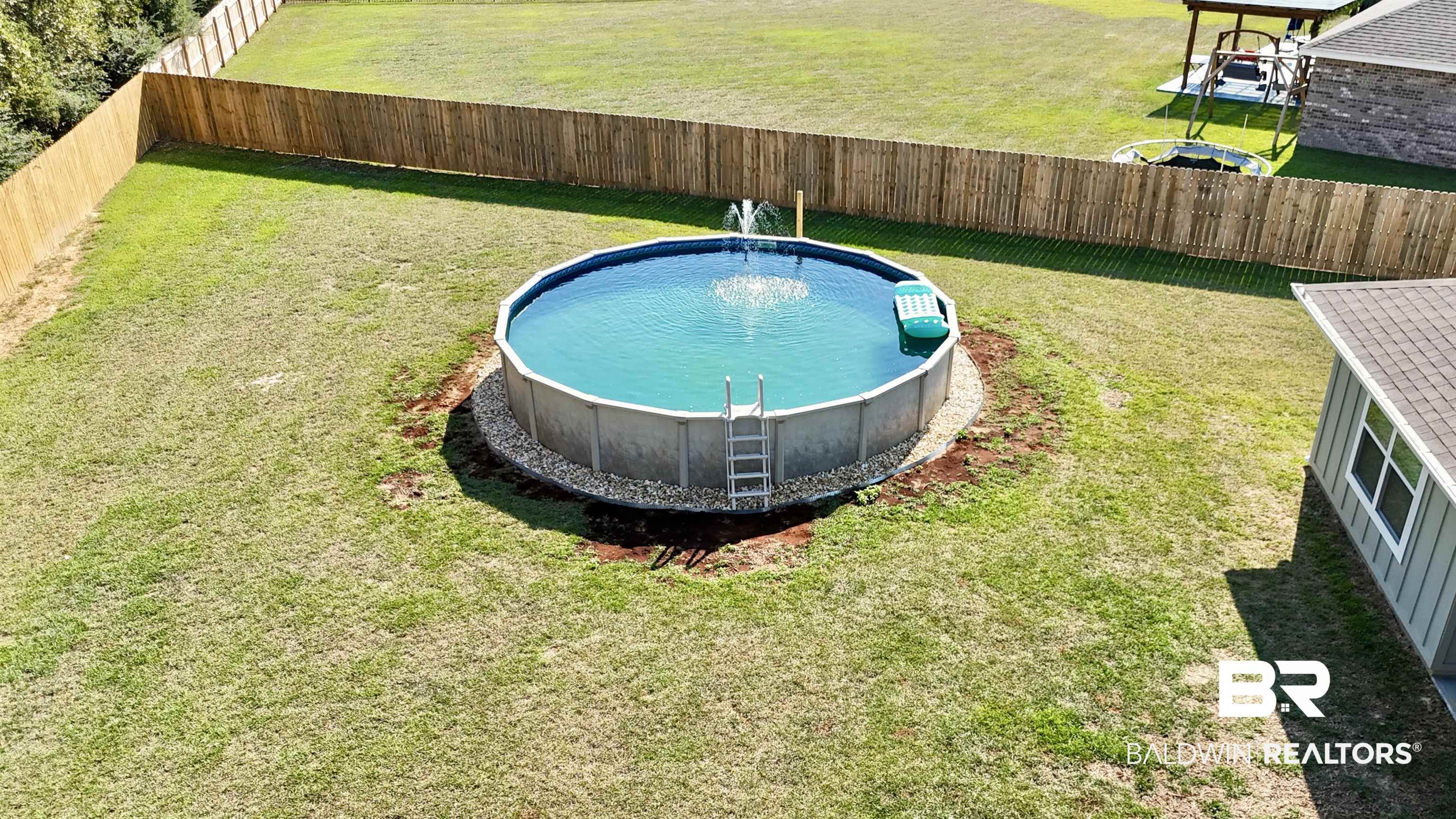 24216 Ringneck Loop Elberta, AL 36530 - Photo 5 of 23 View of swimming pool with a fenced backyard
