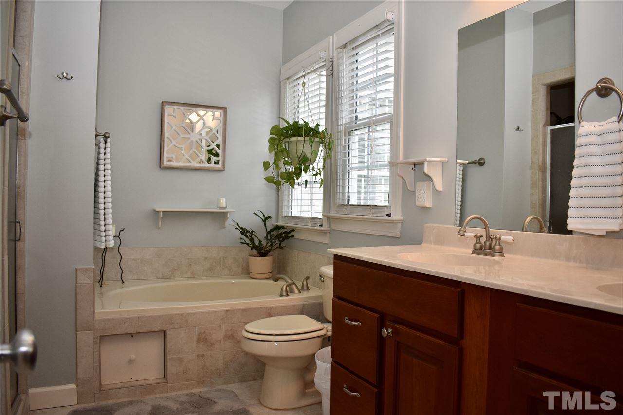 545 Lake Glad Road Wendell, NC 27591 - Photo 12 of 25 Enjoy your JETTED tub and double sinks in your master bathroom flooded with natural light.