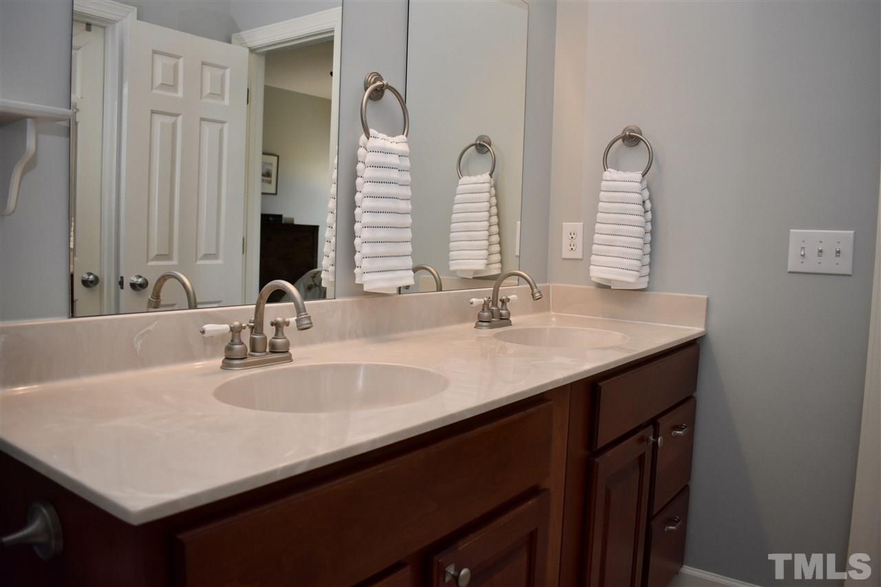 545 Lake Glad Road Wendell, NC 27591 - Photo 13 of 25 Nice double sink vanity with easy-maintenance cultured marble countertop.