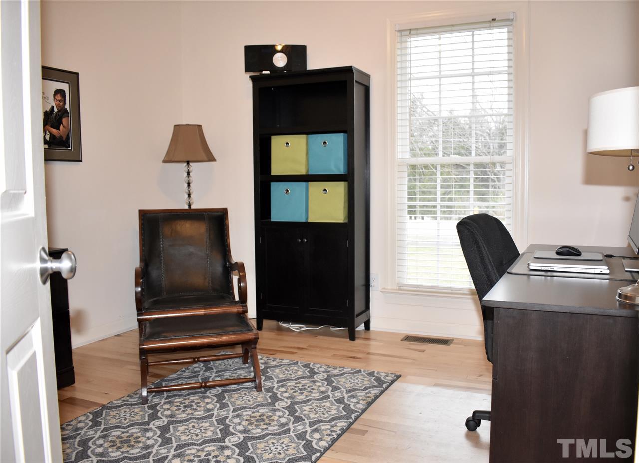 545 Lake Glad Road Wendell, NC 27591 - Photo 15 of 25 This first-floor secondary bedroom is being used as an office but can fit a queen bed.
