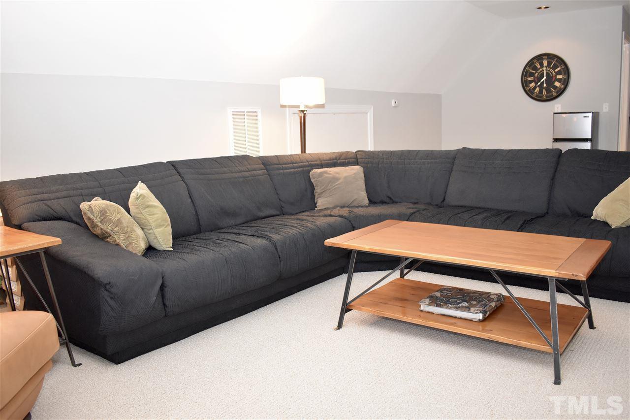 545 Lake Glad Road Wendell, NC 27591 - Photo 21 of 25 Plenty of space for a giant sectional, pool table, whatever you need! Plumbed and wired for a wet bar (behind couch under clock on wall). Nice flow from the flex spaces and next to the 3rd full bathroom.