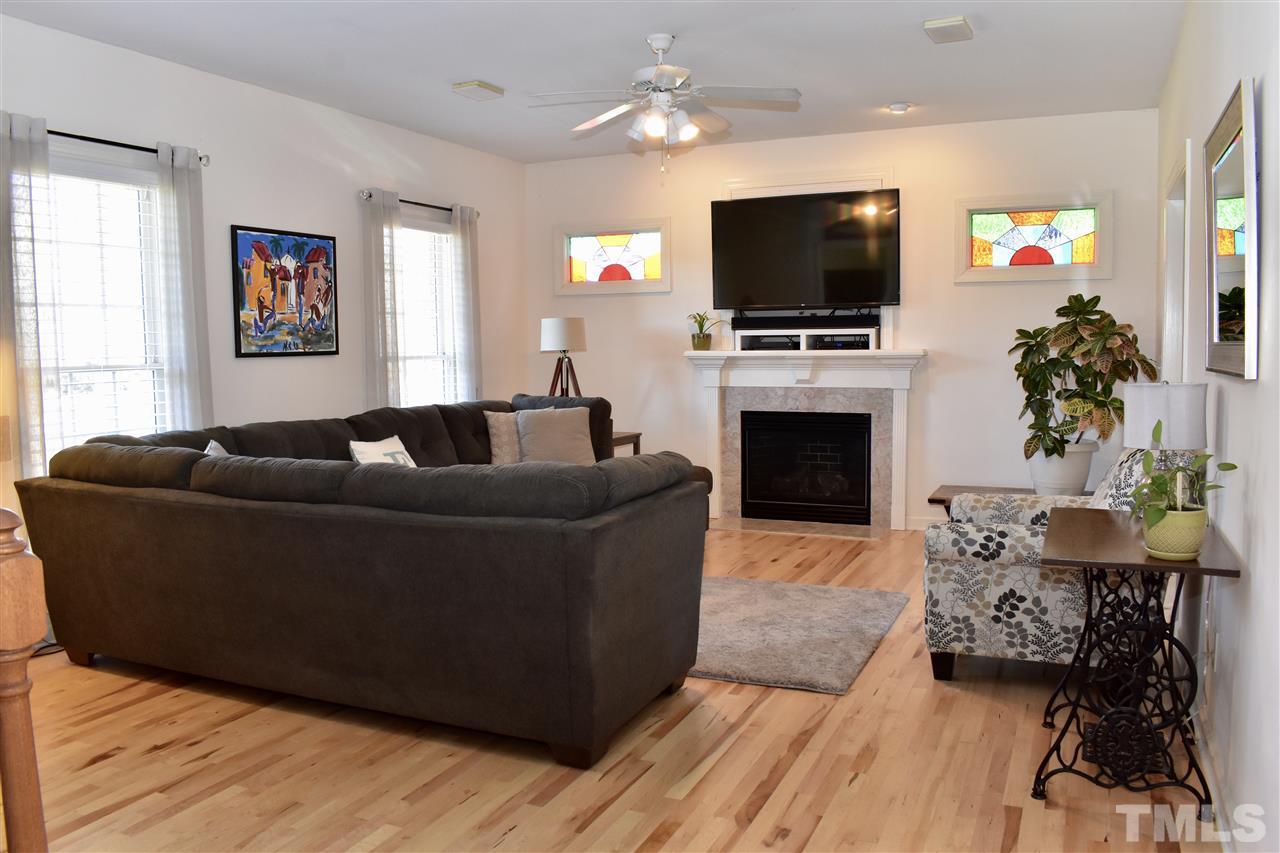 545 Lake Glad Road Wendell, NC 27591 - Photo 4 of 25 Gorgeous light maple hardwood floors highlight the beautiful stained glass windows made by the owner himself.