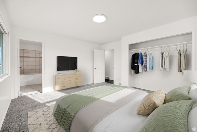 4155 Johnson Road Nibley, UT 84321 - Photo 27 of 71 Virtually staged. Bedroom featuring plush gray carpeting, a built-in open closet system, and a flush-mount ceiling light fixture
