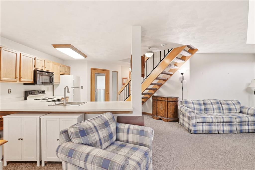 1627 Snowfield Way Hidden Valley, PA 15502 - Photo 13 of 38 a living room with furniture and a flat screen tv