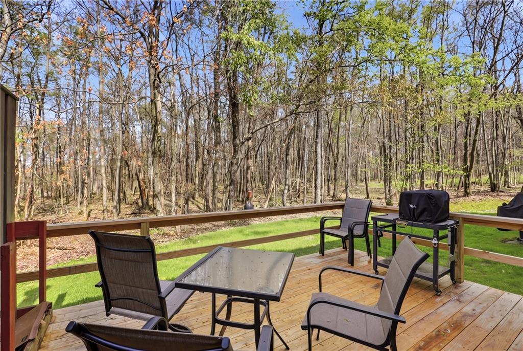 1627 Snowfield Way Hidden Valley, PA 15502 - Photo 25 of 38 a chair and a table in a backyard