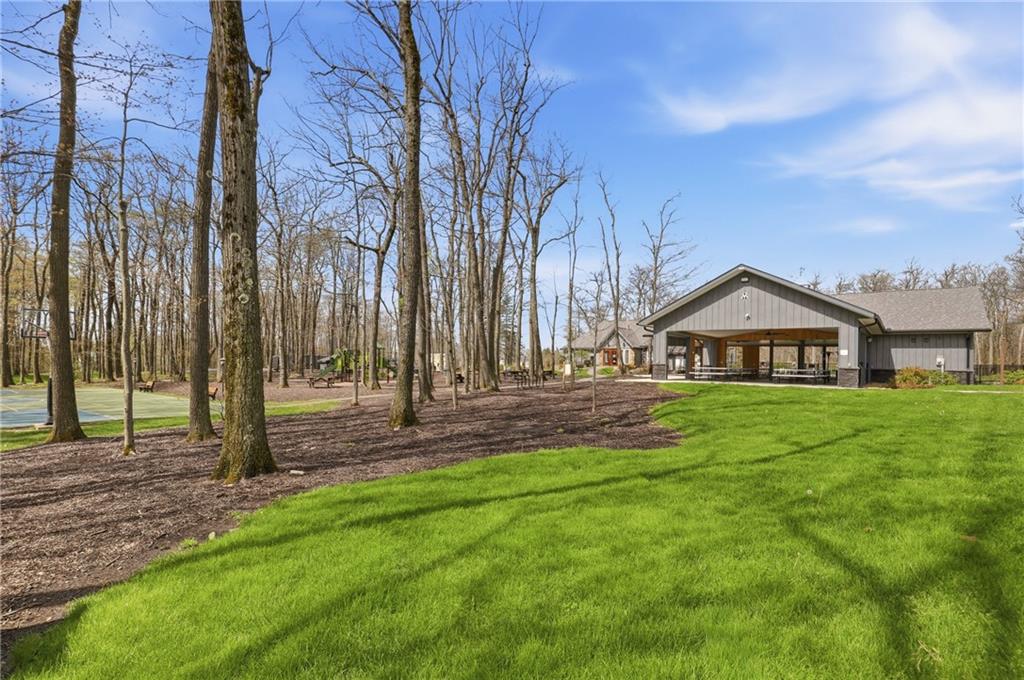 1627 Snowfield Way Hidden Valley, PA 15502 - Photo 28 of 38 a view of a house with a big yard and large trees