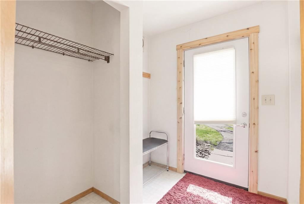 1627 Snowfield Way Hidden Valley, PA 15502 - Photo 6 of 38 a view of an empty room with a window and wooden floor
