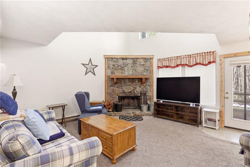 1627 Snowfield Way Hidden Valley, PA 15502 - Photo 10 of 38 a living room with furniture and a flat screen tv