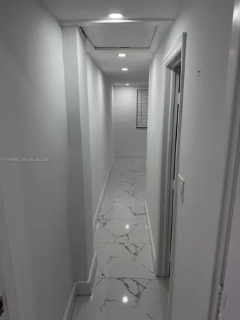 a room with a table and chairs