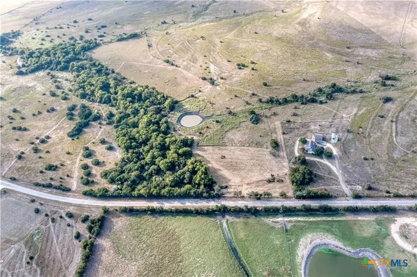 an aerial view of a house with a lake view