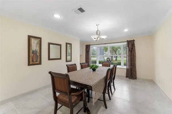 a view of a dining room with furniture window and outside view