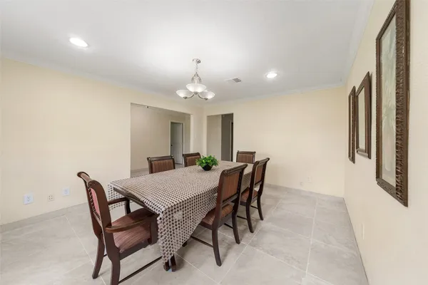 a view of a dining room with furniture and window
