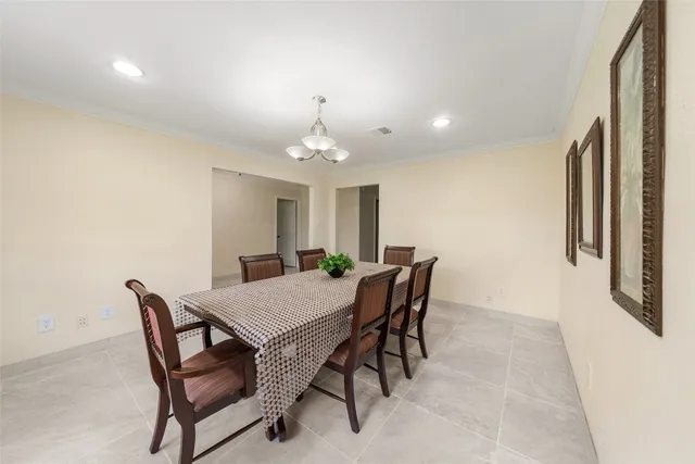 a view of a dining room with furniture and window