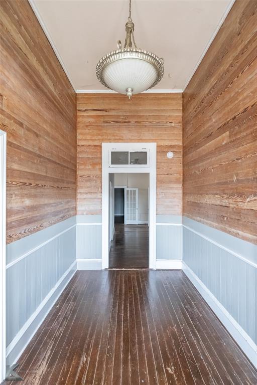 141 East 3rd Street Baird, TX 79504 - Photo 4 of 33 a view of empty room with wooden floor and fireplace
