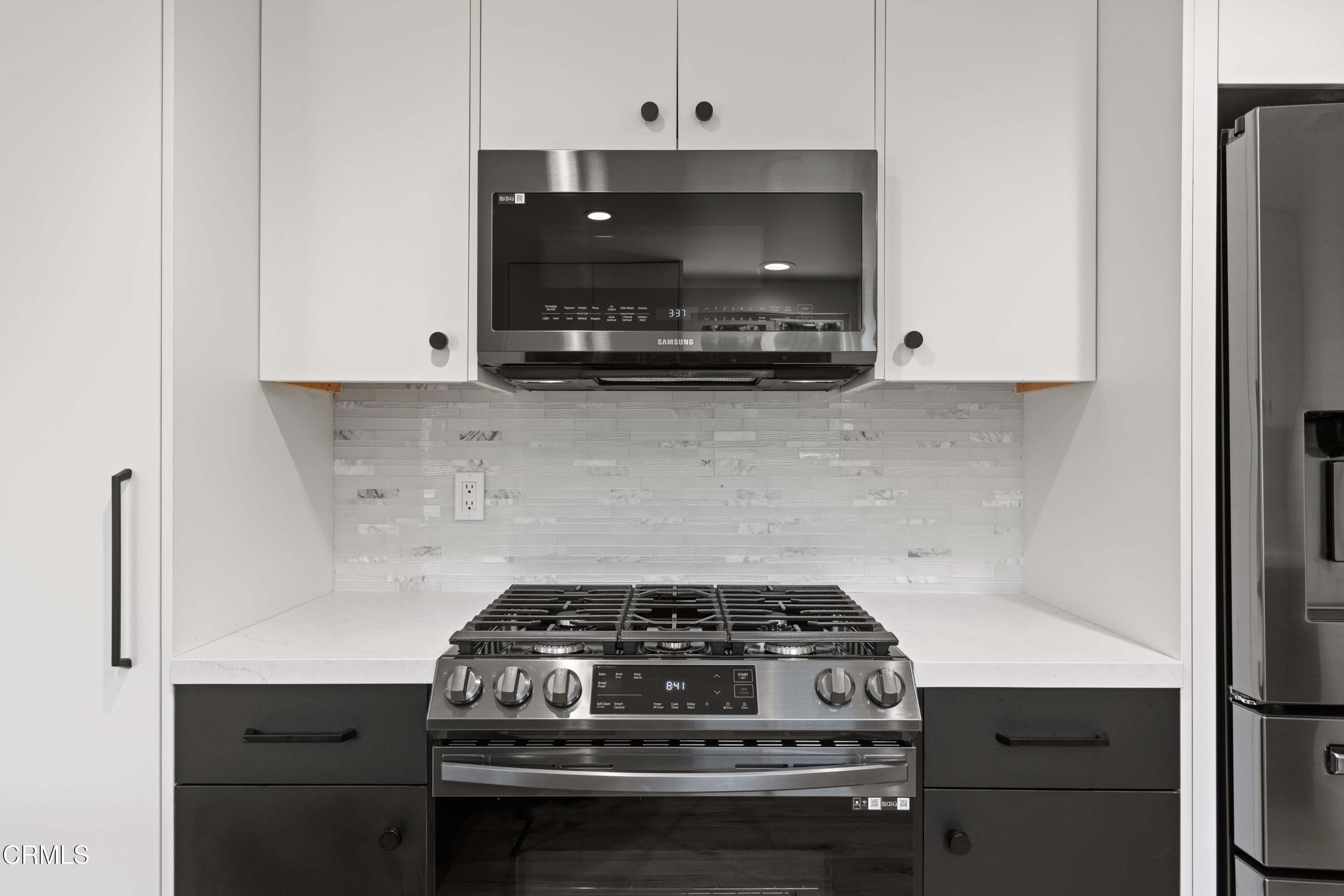 246 3rd Street Solvang, CA 93463 - Photo 11 of 33 a stove top oven sitting inside of a kitchen