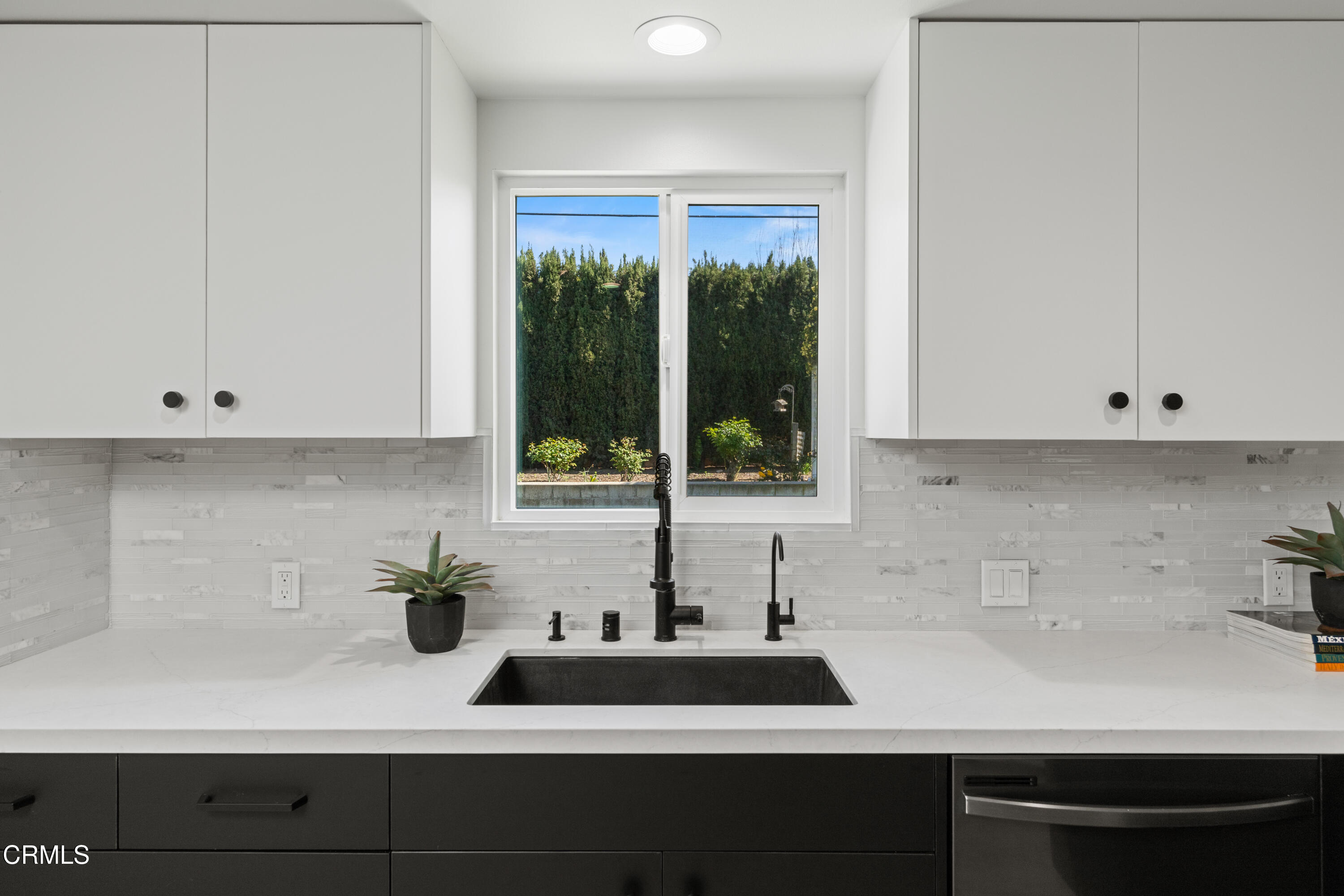 246 3rd Street Solvang, CA 93463 - Photo 12 of 33 a kitchen with a sink and large window
