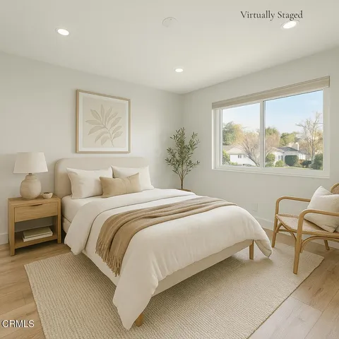 a bedroom with a large bed and a window