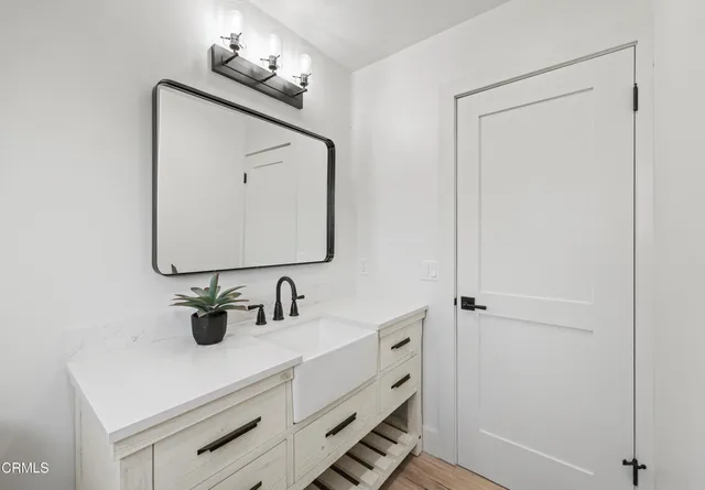 a bathroom with a sink and a mirror