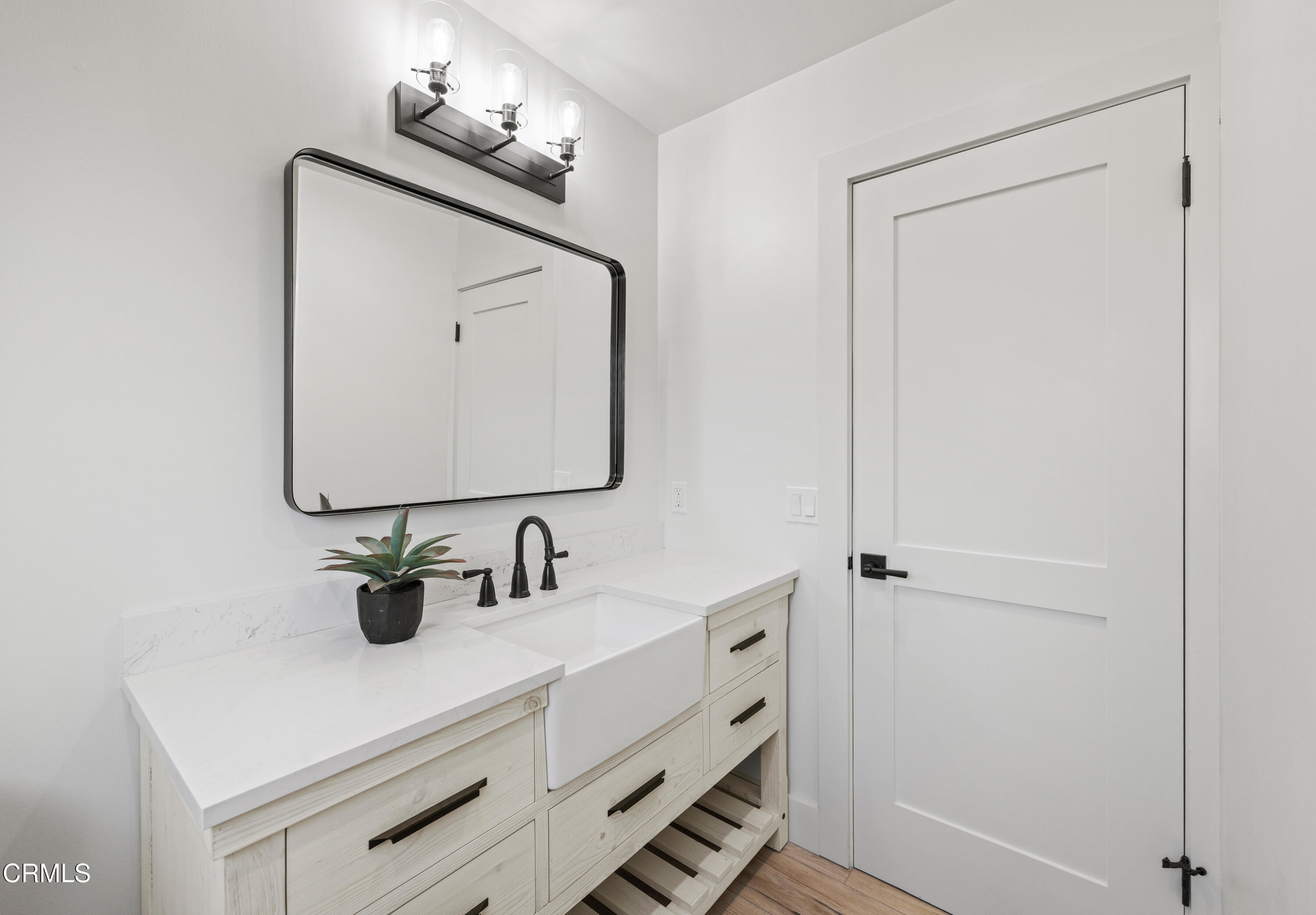 246 3rd Street Solvang, CA 93463 - Photo 15 of 33 a bathroom with a sink and a mirror