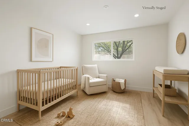 a bedroom with furniture and a window