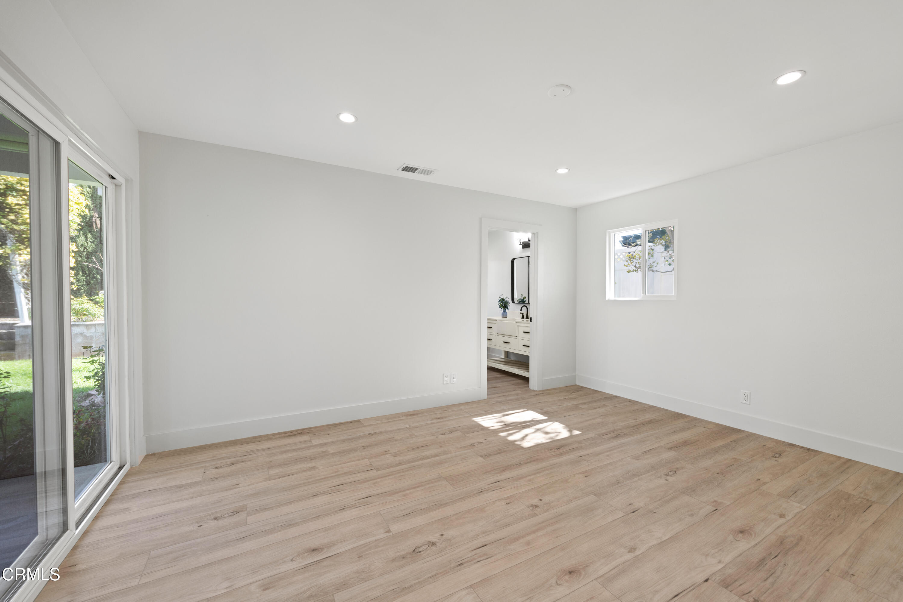 246 3rd Street Solvang, CA 93463 - Photo 20 of 33 a view of an empty room with window and wooden floor