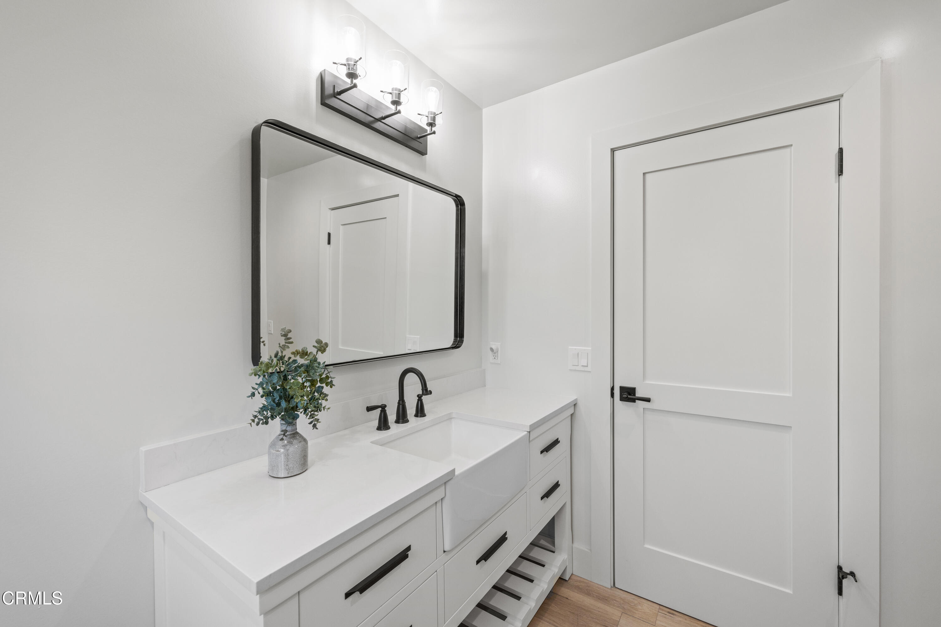 246 3rd Street Solvang, CA 93463 - Photo 22 of 33 a bathroom with a sink vanity and mirror