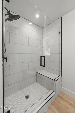 a bathroom with a shower and a shower