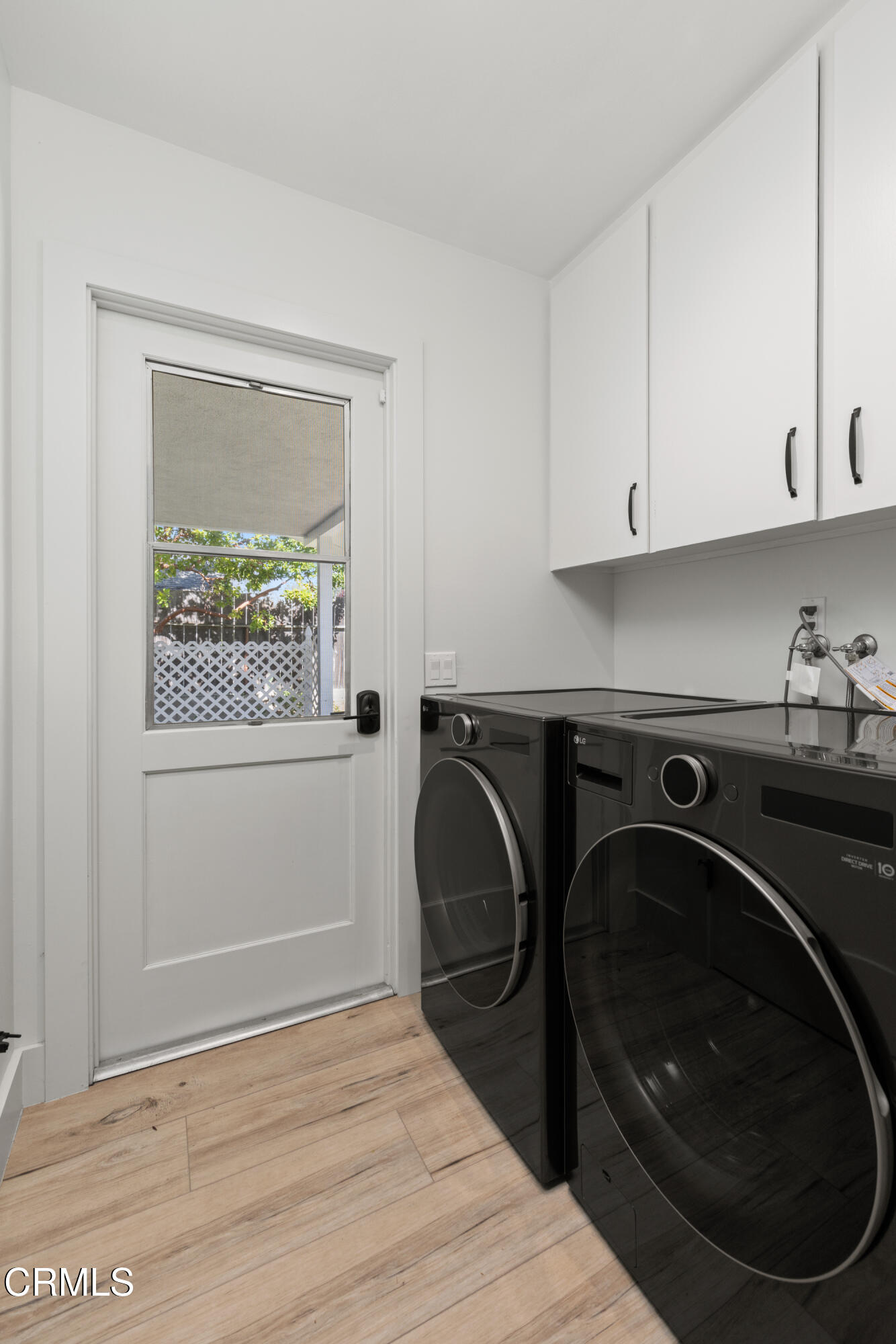 246 3rd Street Solvang, CA 93463 - Photo 25 of 33 a utility room with sink dryer and washer