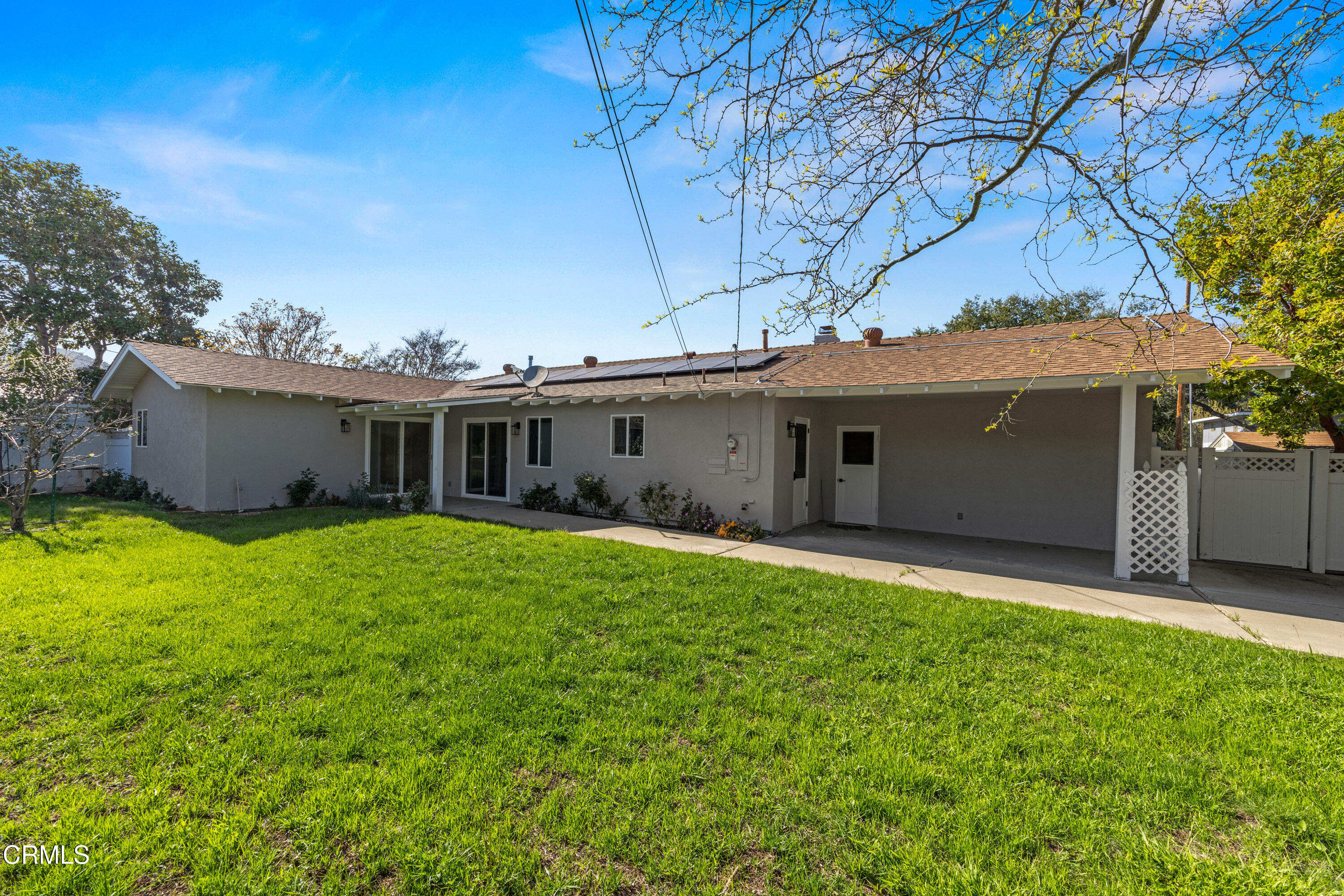 246 3rd Street Solvang, CA 93463 - Photo 27 of 33 a front view of a house with a garden and yard