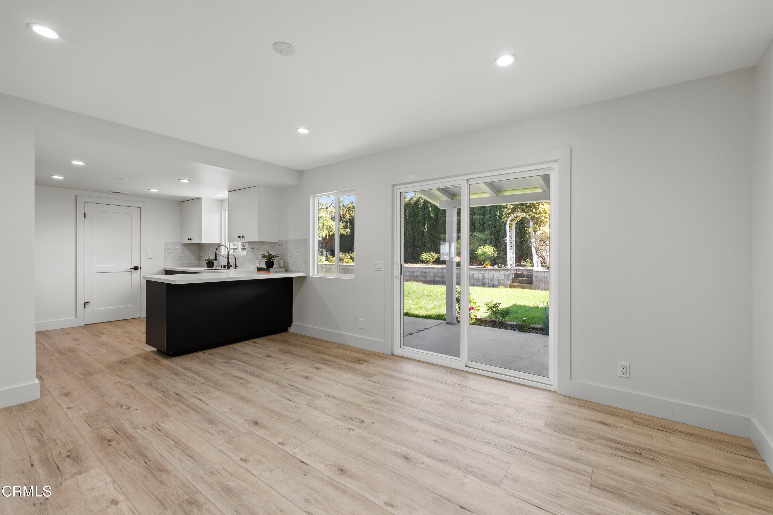 246 3rd Street Solvang, CA 93463 - Photo 8 of 33 a view of kitchen and kitchen with wooden floor