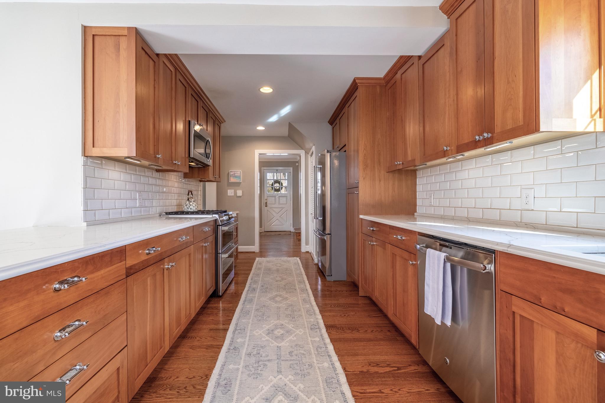 1910 Everest Street Silver Spring, MD 20902 - Photo 6 of 21 Abundant wood cabinetry, Quartz countertops