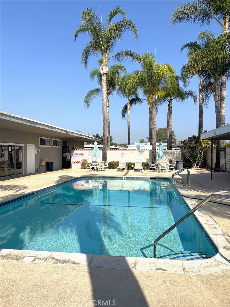 10745 Victoria Avenue, Unit 4 Whittier, CA 90604 - Photo 16 of 16 a view of a house with a swimming pool