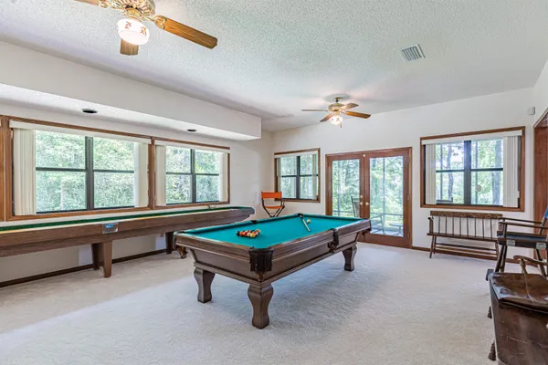 a bed sitting in a room next to a window