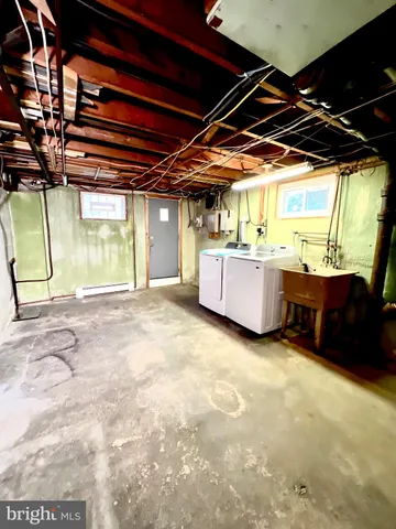 a view of an empty room with a kitchen