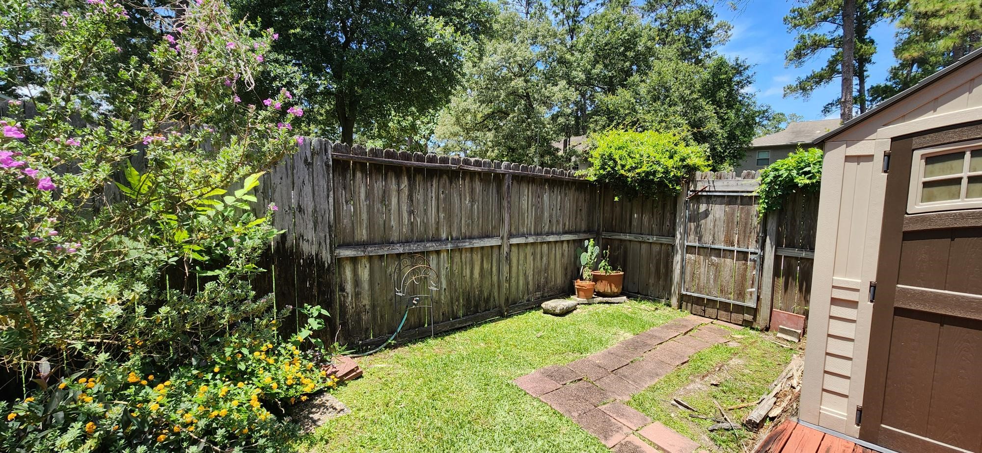 16155 Hexham Drive Spring, TX 77379 - Photo 47 of 47 a backyard of a house with table and chairs