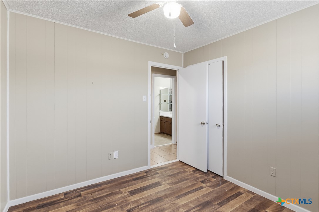 102 Runnel Street Seguin, TX 78155 - Photo 16 of 34 a view of an empty room with wooden floor