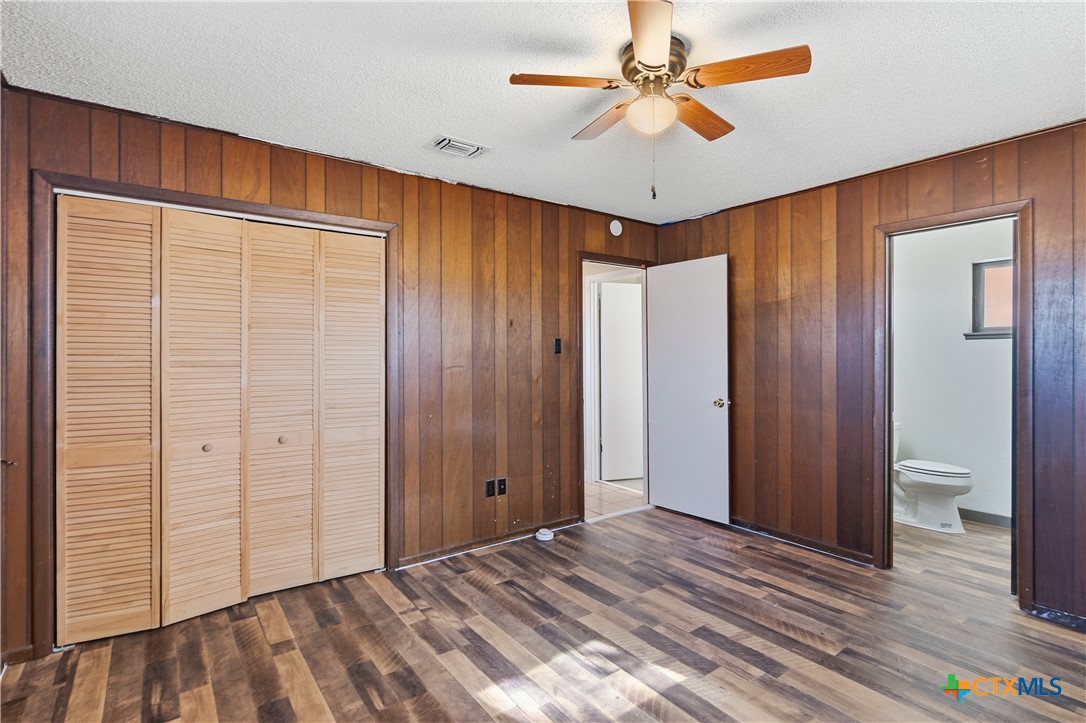 102 Runnel Street Seguin, TX 78155 - Photo 18 of 34 wooden floor in an empty room with a closet