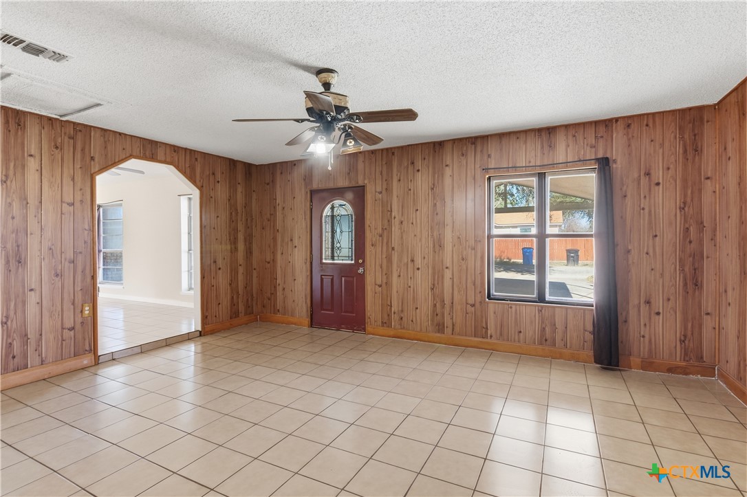 102 Runnel Street Seguin, TX 78155 - Photo 22 of 34 an empty room with windows and fan
